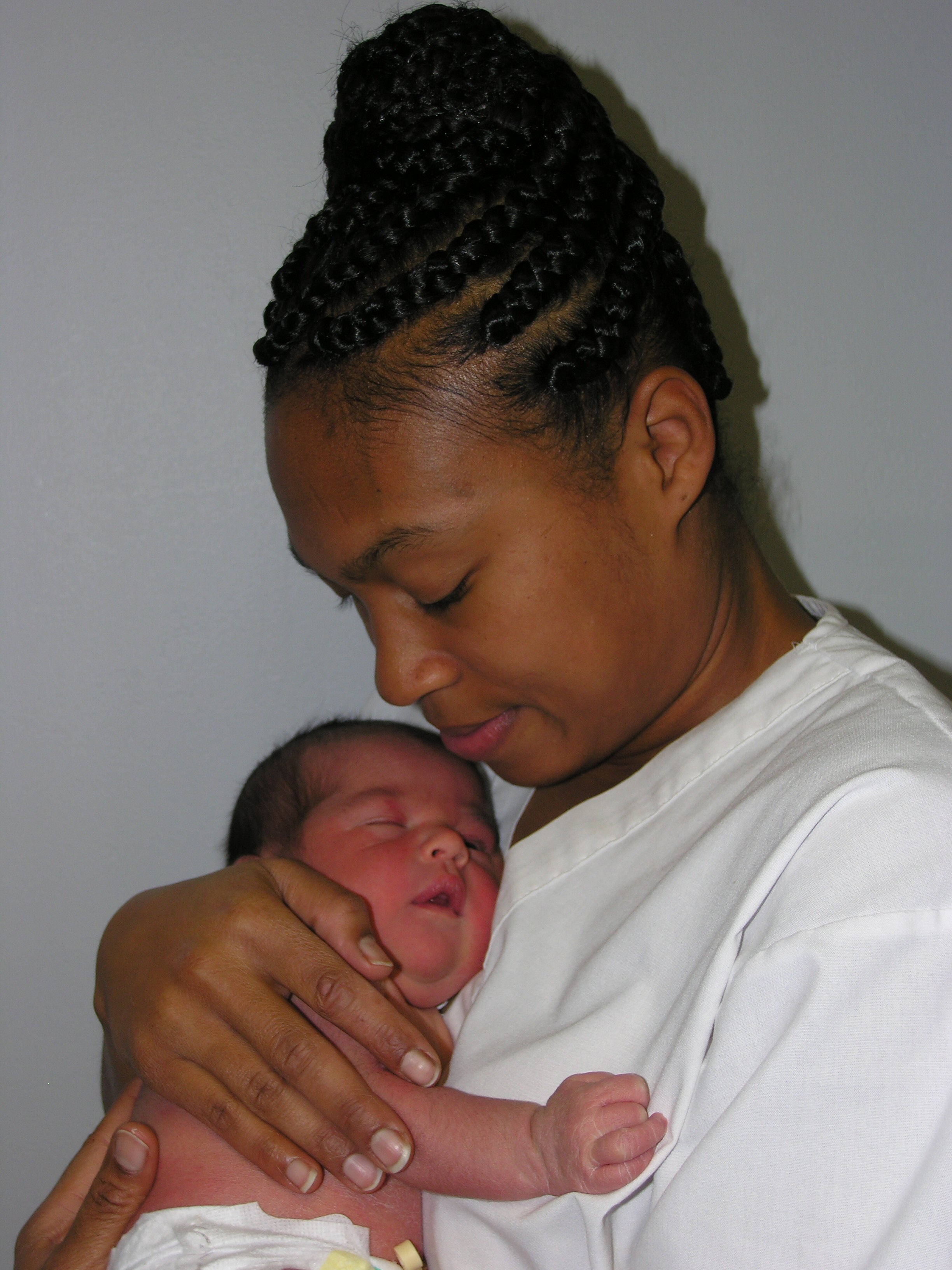 Black mother holding a newborn baby