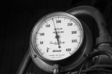 Black and white pressure gauge reaches almost its maximum intensity.