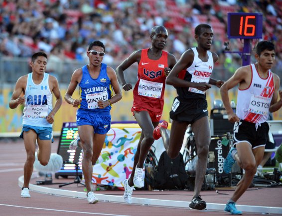 5 men running on a track