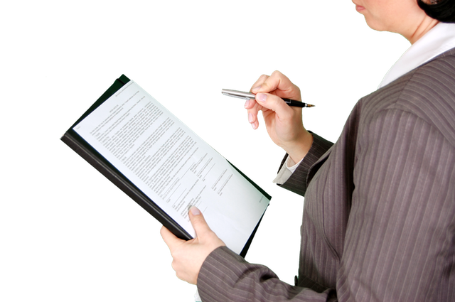 a woman signing a form on a tablet