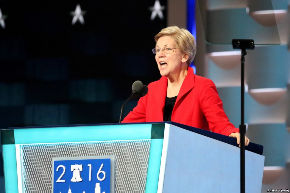 Elizabeth Warren speaking at podium