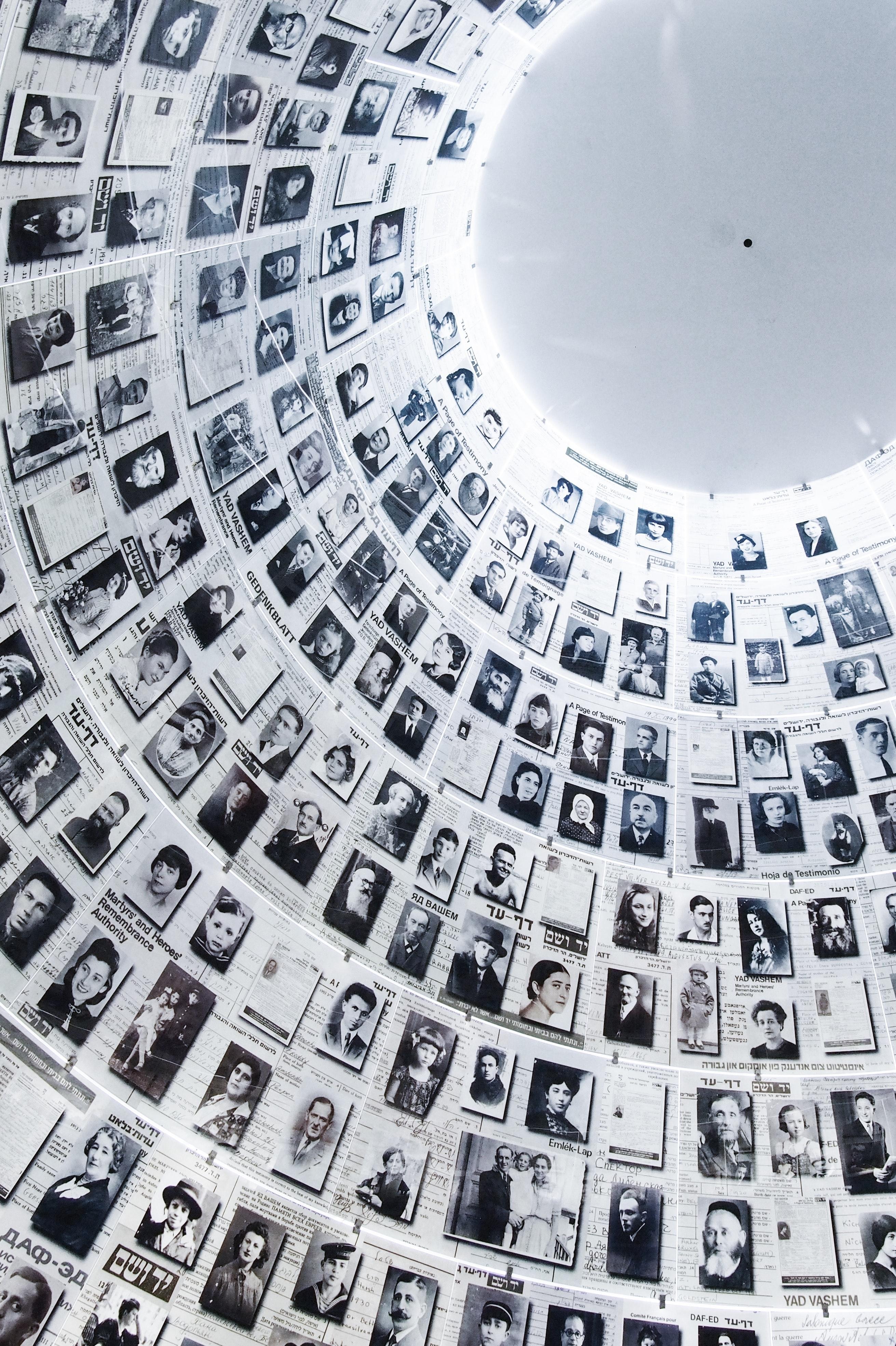 wall of pictures of hundreds of Holocaust victims