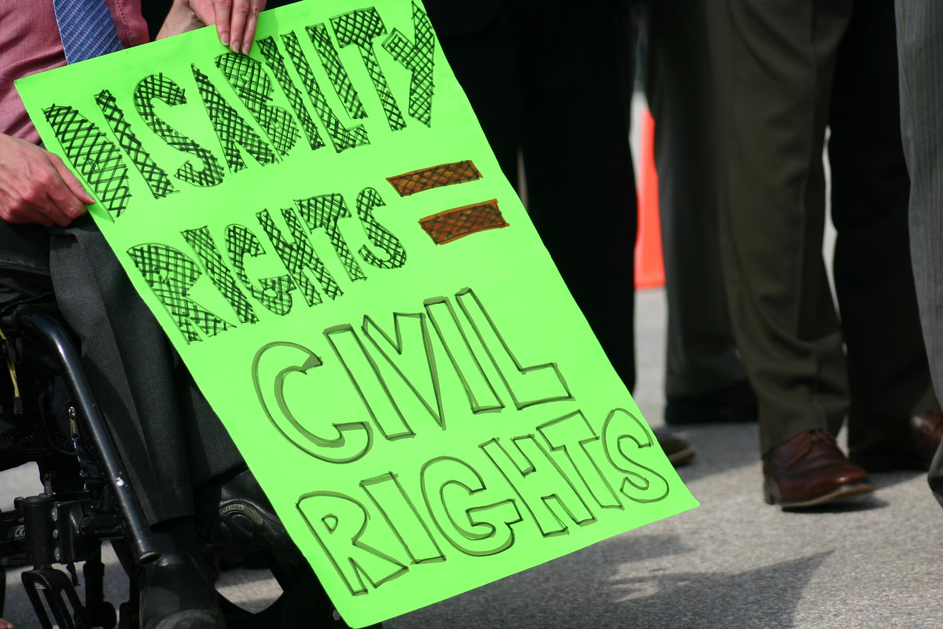 Green sign stating disability rights = civil rights