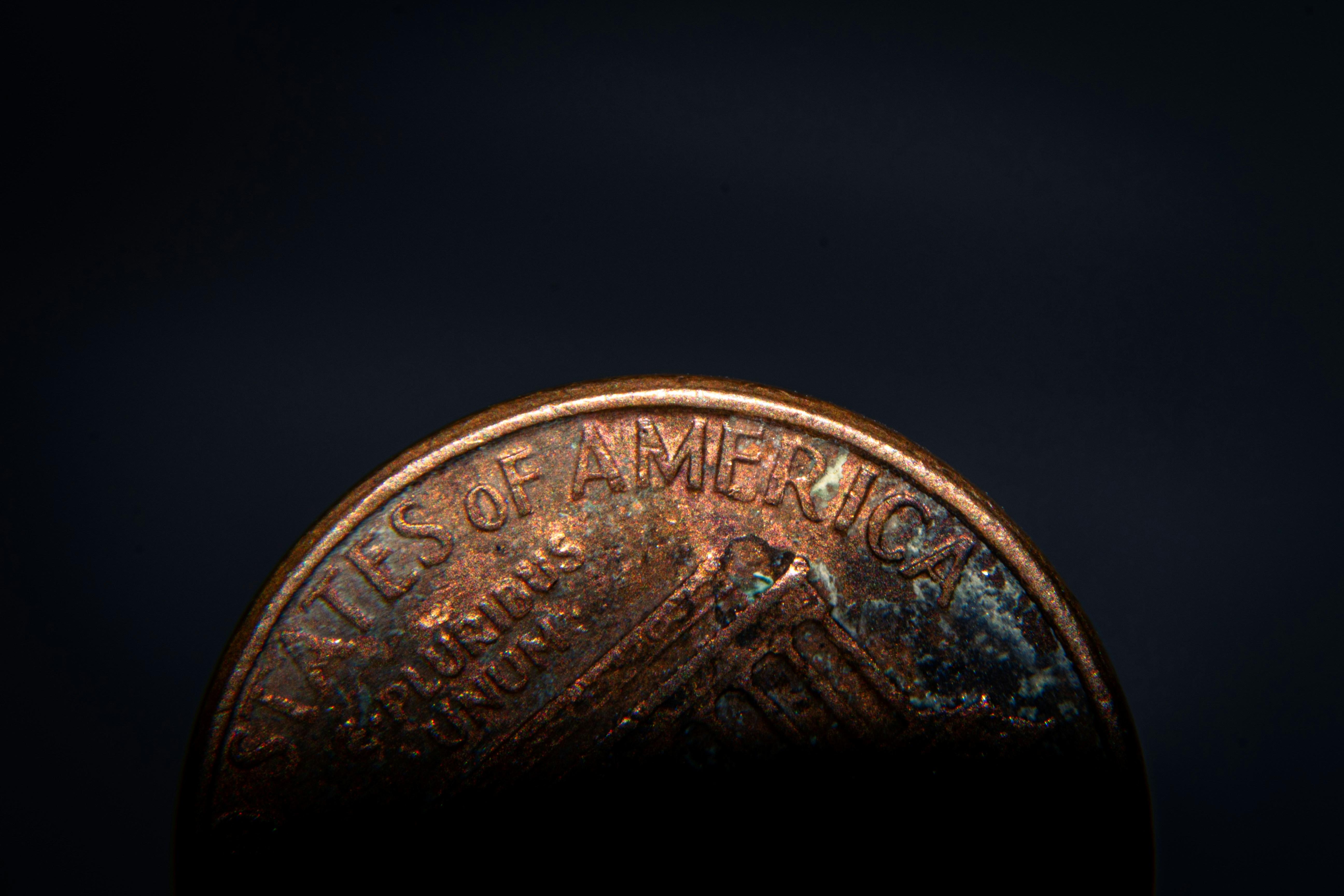 Image of a penny over a black background