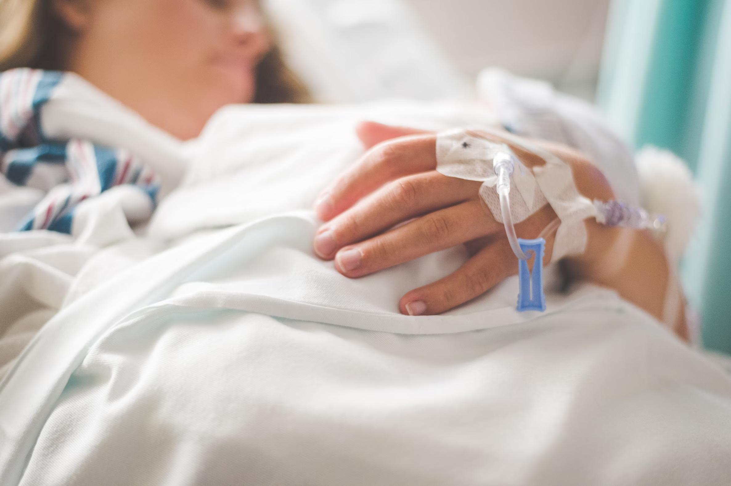 woman laying with an iv