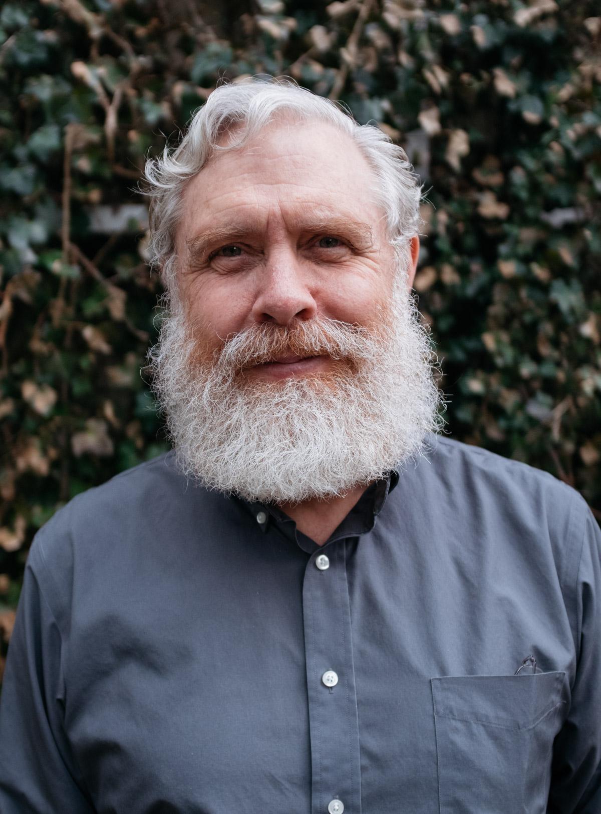 Photo of George Church, a white man with white hair and beard