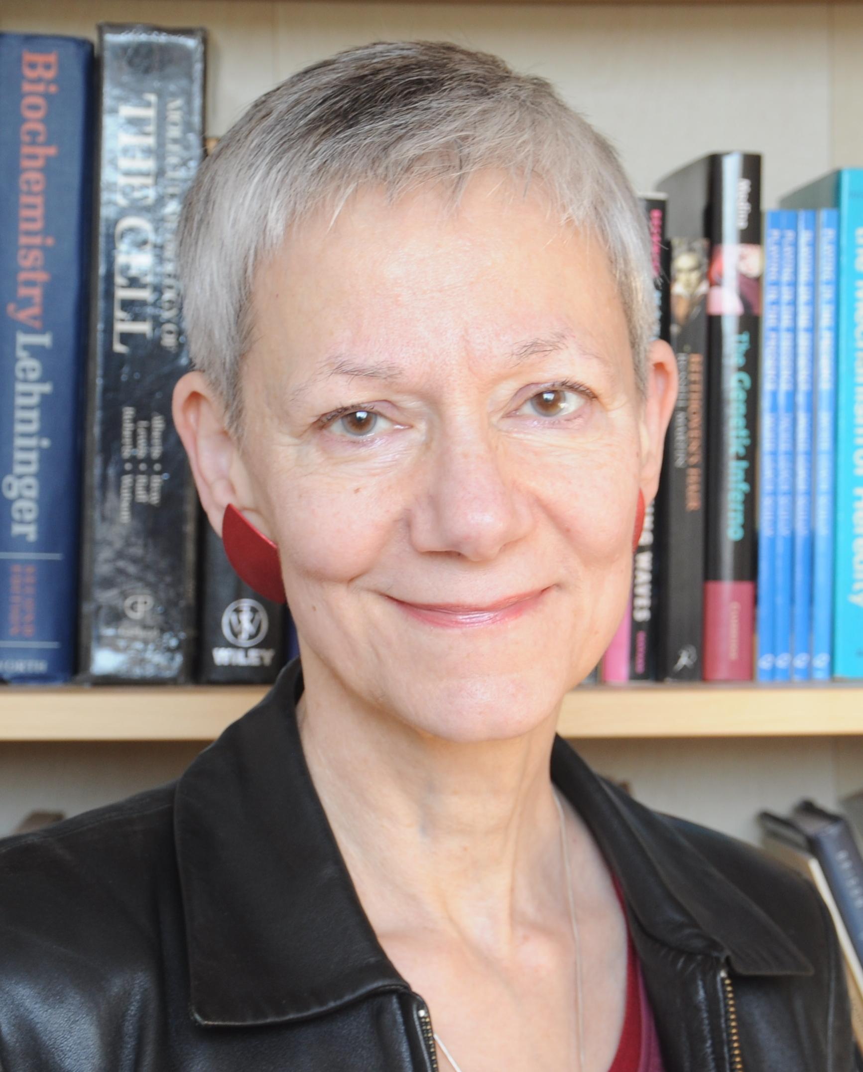 Headshot of Jackie Scully, a woman with short grey hair 